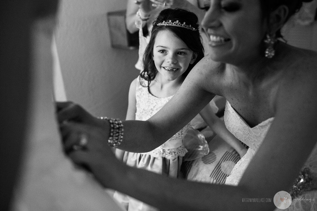 The flower girl follows every move the bride makes as she gets ready for her Brophey Chapel wedding ceremony