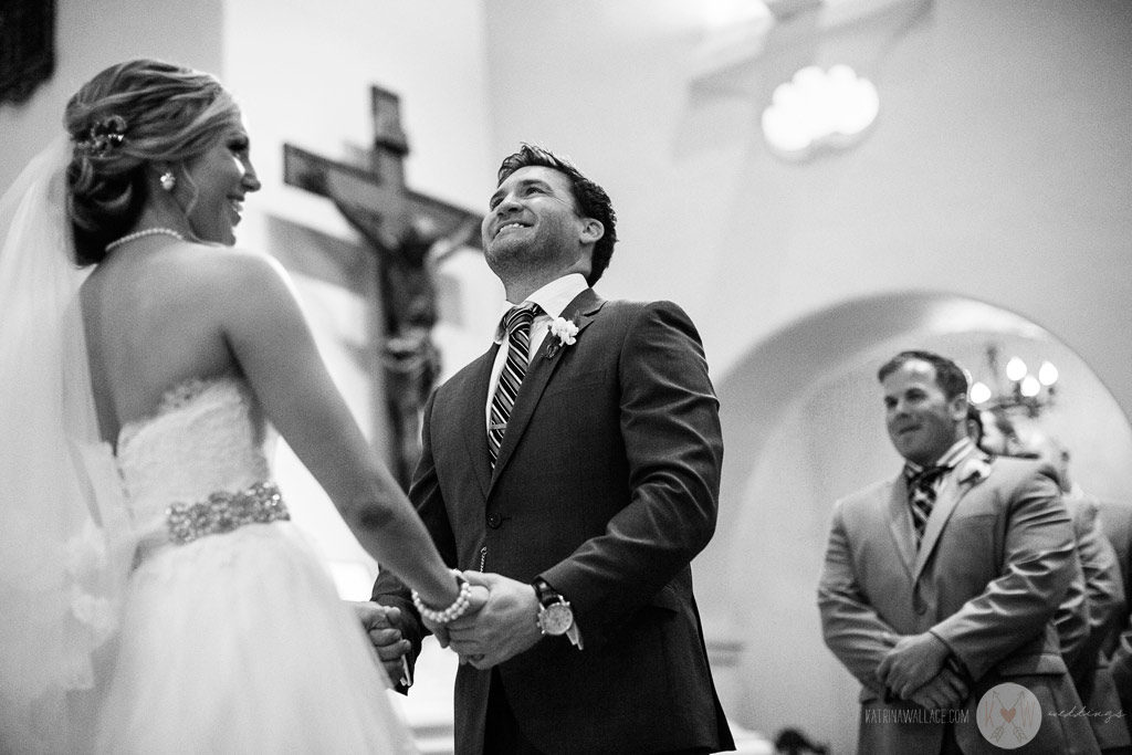 Alex has a quick laugh during the priest's ceremony during the Brophey Chapel ceremony