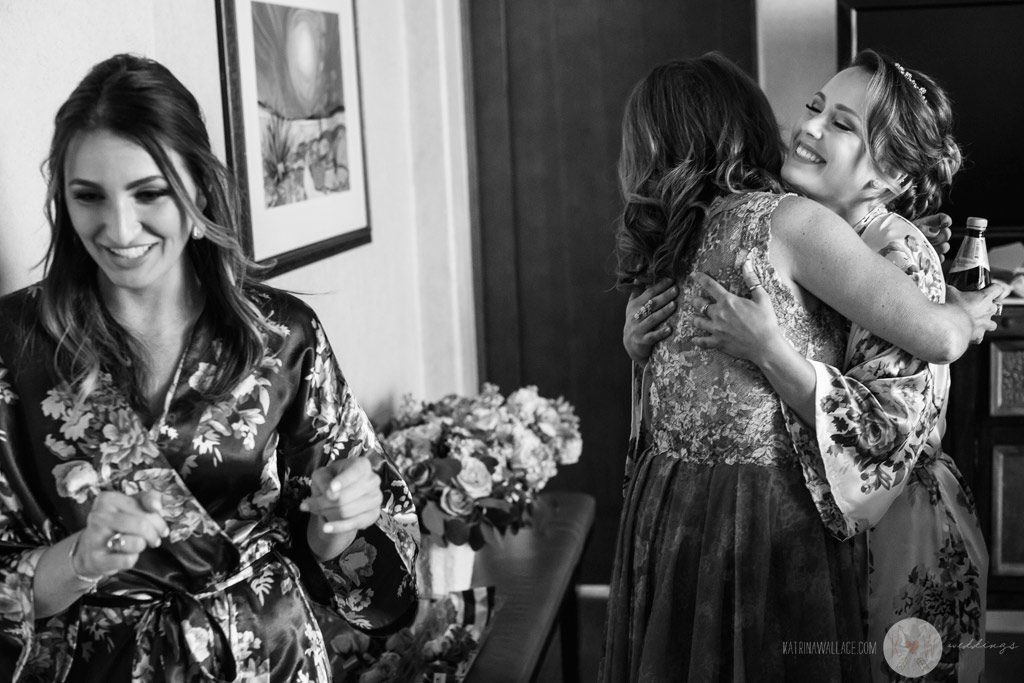The bridesmaids hug with excitement about the wedding day at Four Seasons Scottsdale