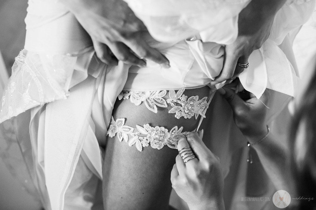 At the Four Seasons Scottsdale, the bride gets her gown on with the help of her sisters and bridesmaids