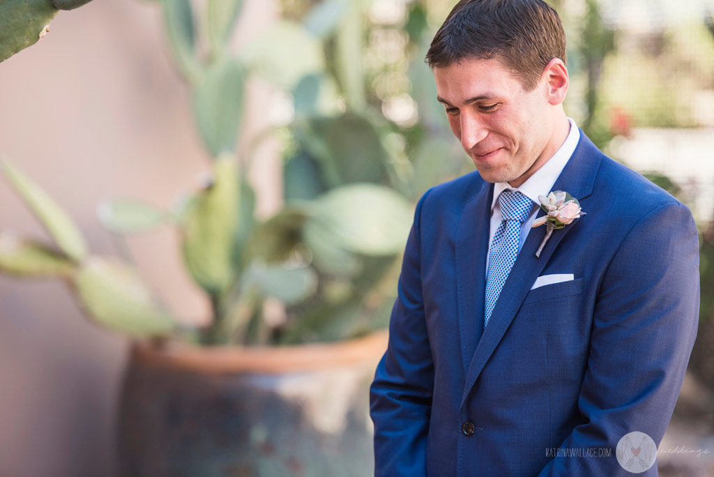 The handsome groom waits nervously for the bride just before they meet for the first time that day at the Four Seasons Scottsdale