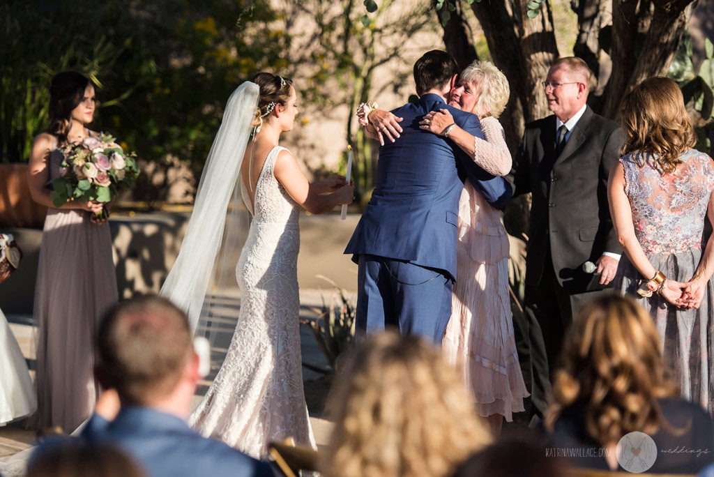 The Mothers exchange a hug after a quick candle-lighting ceremony at the Four Seasons Scottsdale wedding.