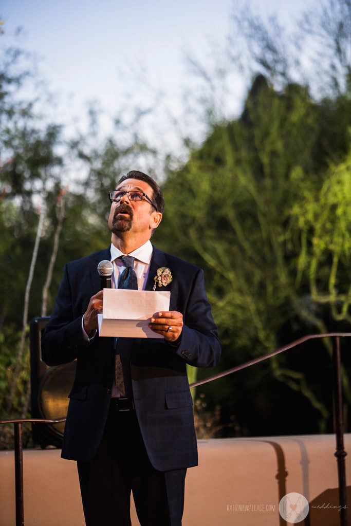 The bride's step-father offers up a toast to the bride and groom.