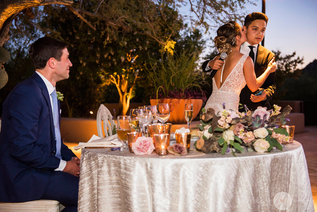 The bride's father offers a prayer and a toast to the bride and groom.