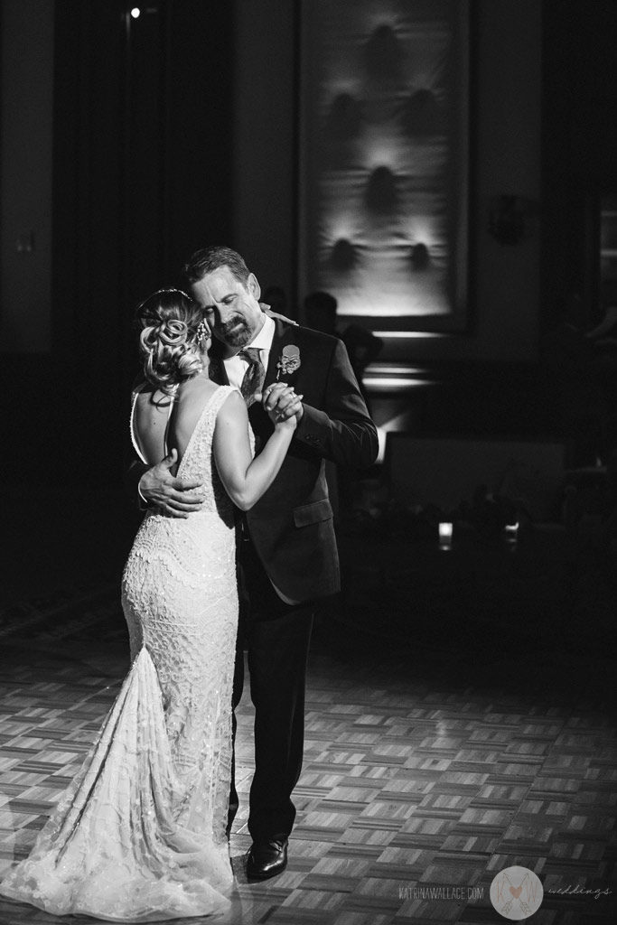 The bride's mother and sister tear up watching the father daughter dance.