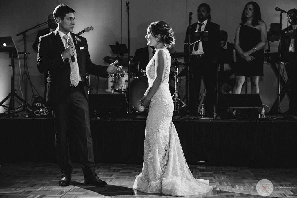 The bride and groom blush as the toasts come in.