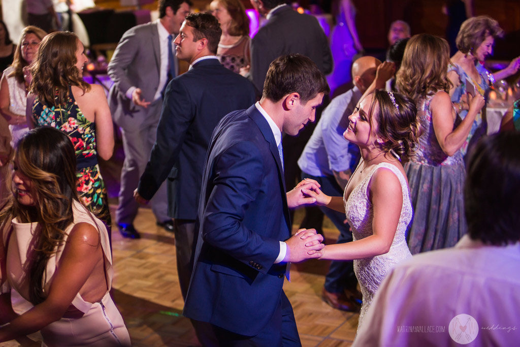 The bride and guests clap and dance to the traditional Italian wedding song.