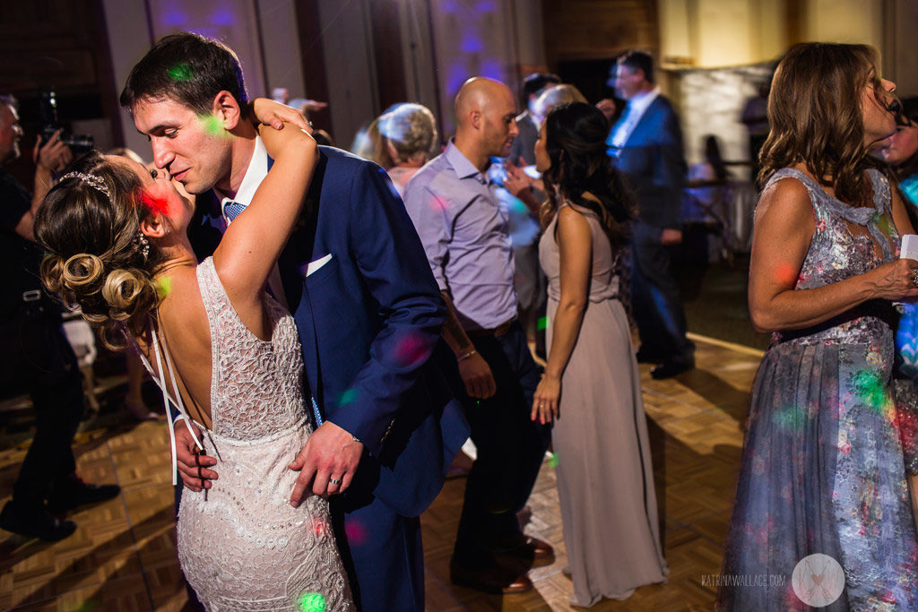 The bride and groom enjoy some dancing together.