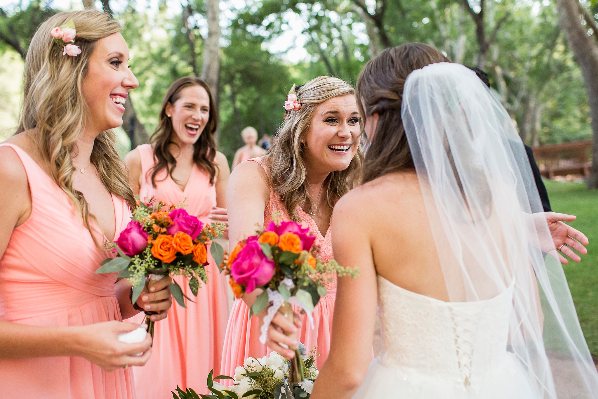 Los Abrigados wedding photo of a bridesmaid reaching out to hug the bride