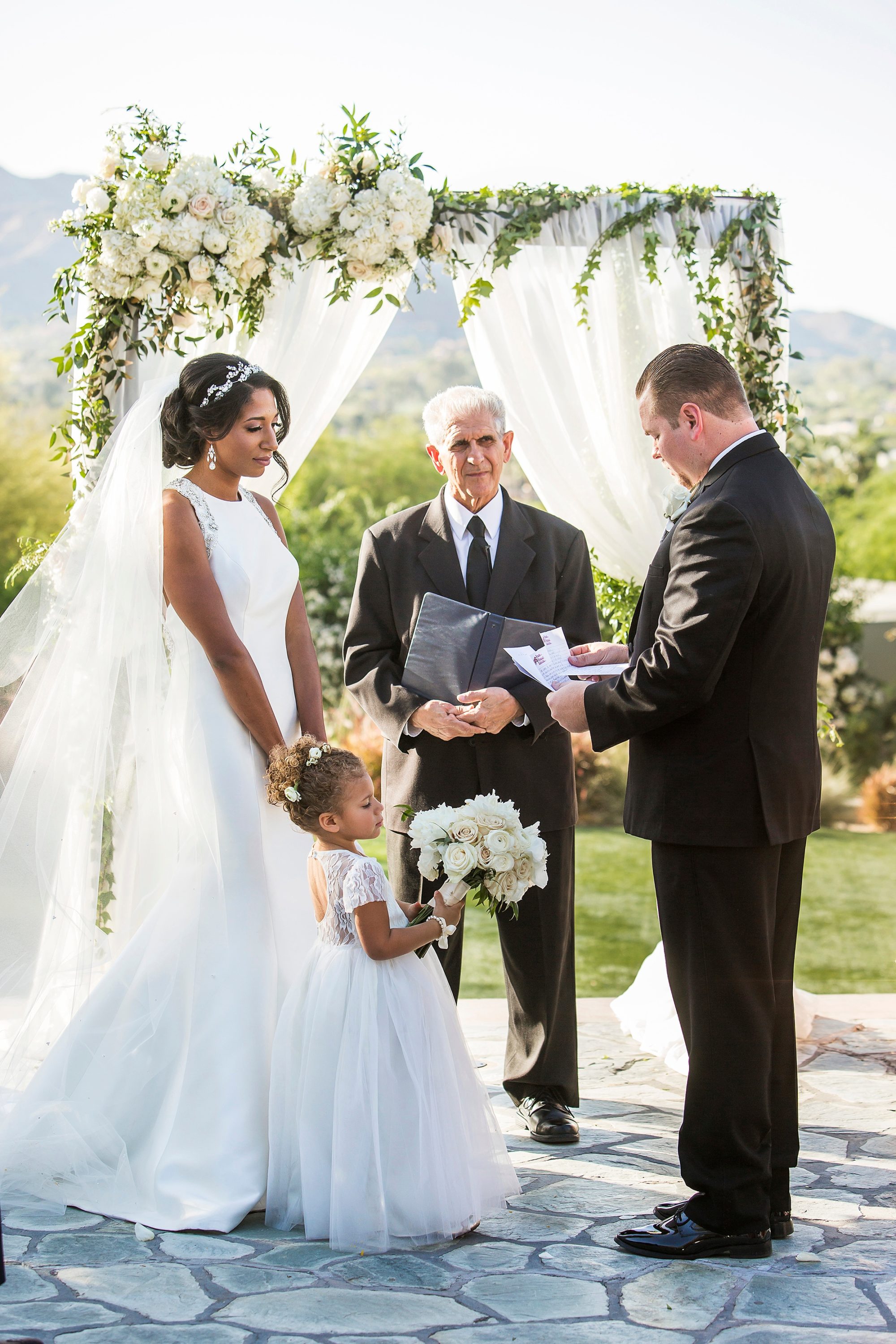 Sanctuary Resort wedding ceremony photo of a bride and groom and their daughter during their wedding