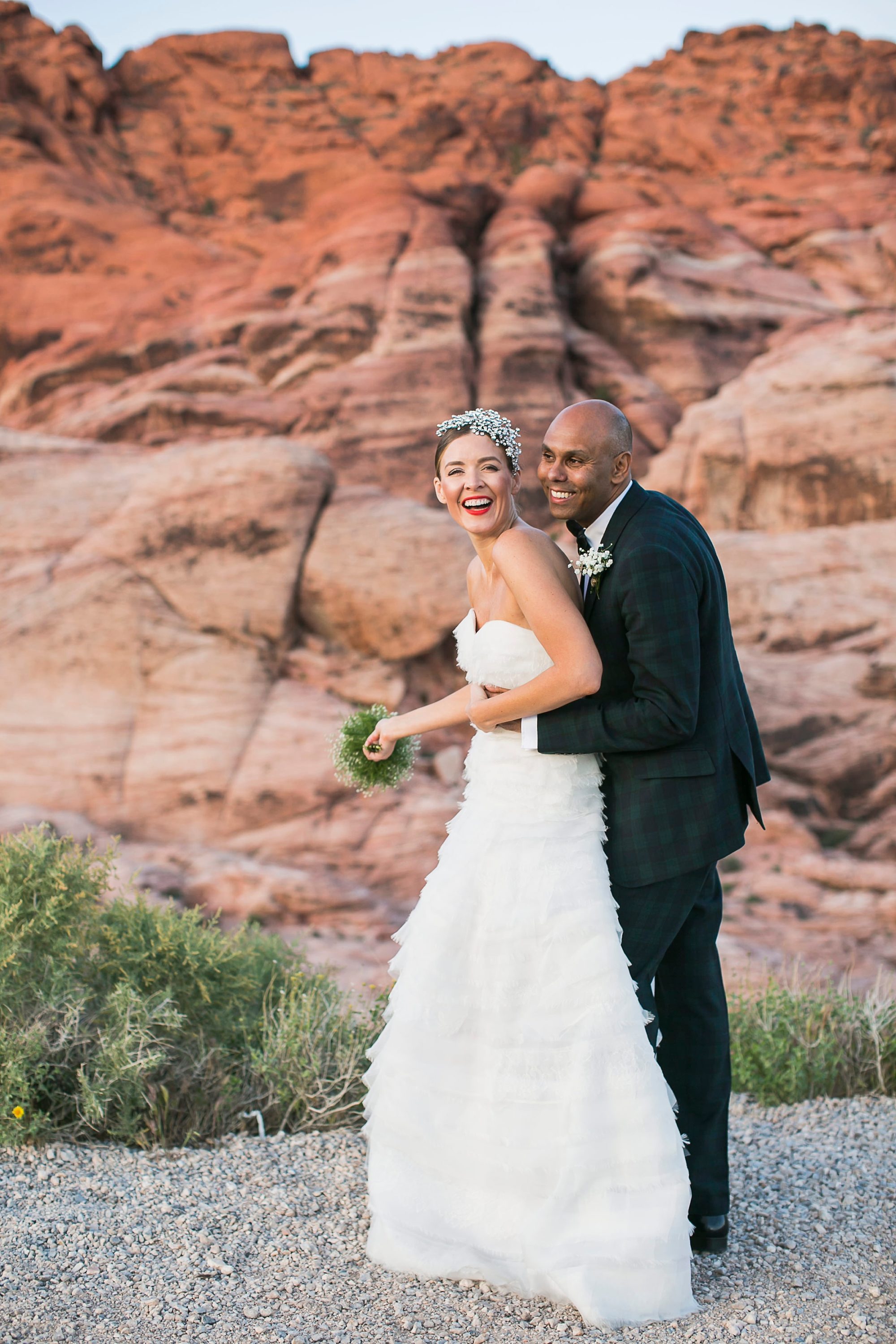 Red Rock Canyon Nevada wedding photo of a bride and groom in front of the red rocks