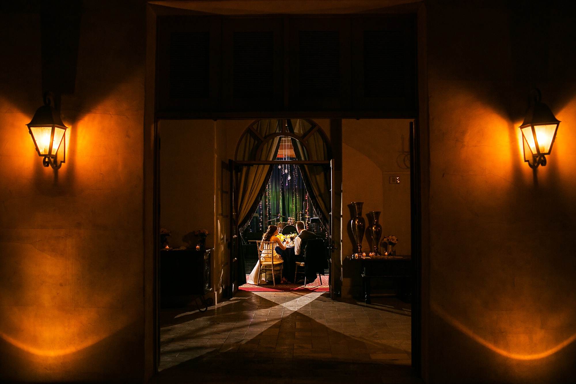 Royal Palms wedding reception photo of a bride and groom seated at their wedding reception in the Estrella Salon