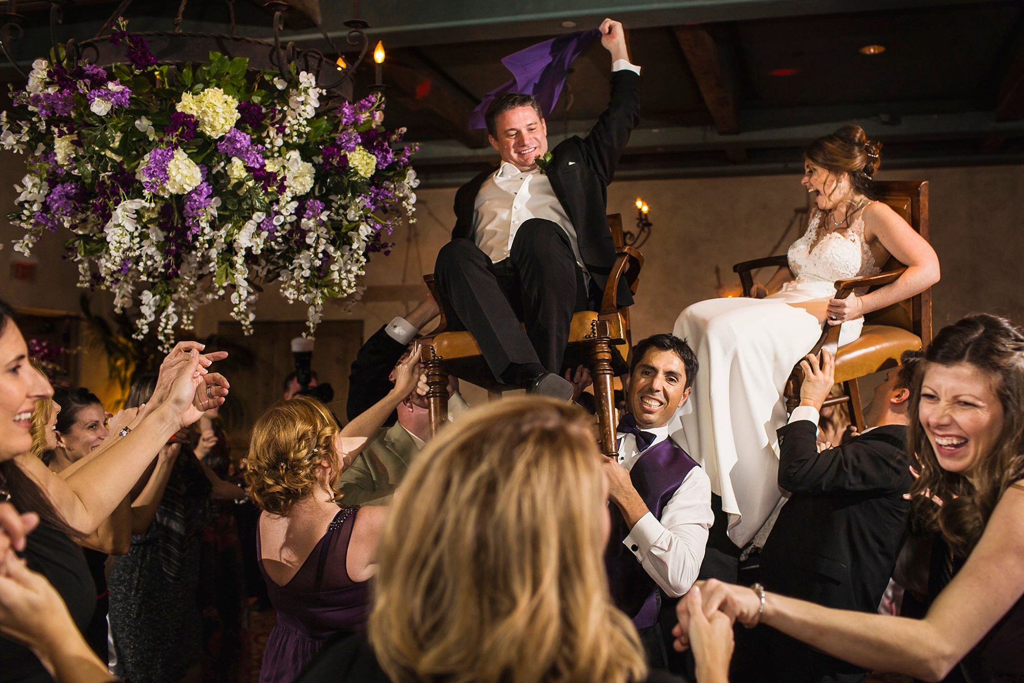 Royal Palms wedding reception couple on chairs for the Jewish wedding dance called the hora